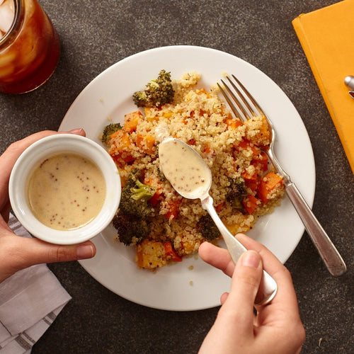 Dressing spooned over Quinoa with vegetables with chicken Eat Smart RVA meal delivery service