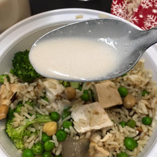 Load image into Gallery viewer, Spoonful of dressing over chicken and rice bowl Eat Smart RVA meal delivery service
